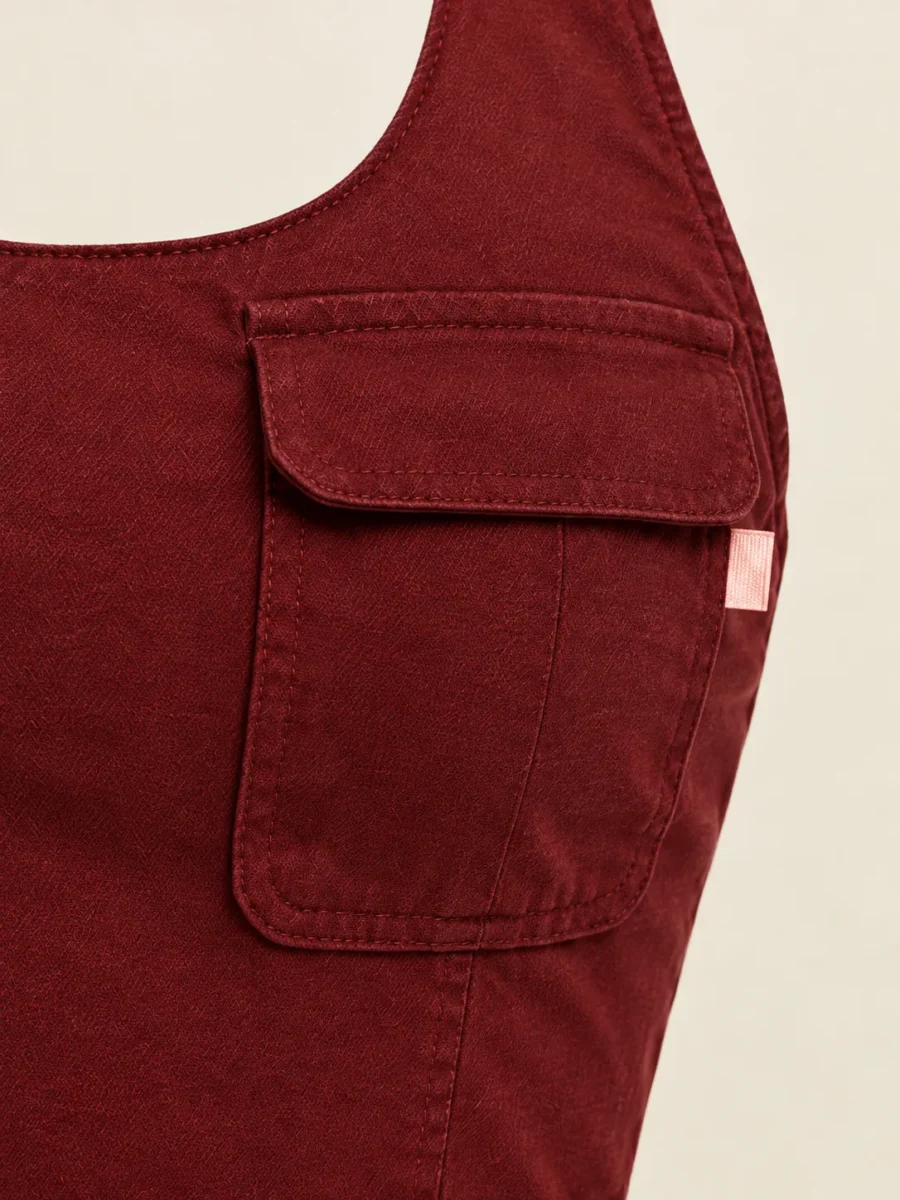 Halter Cargo Top Vest in Cherry, close-up of pockets and hardware