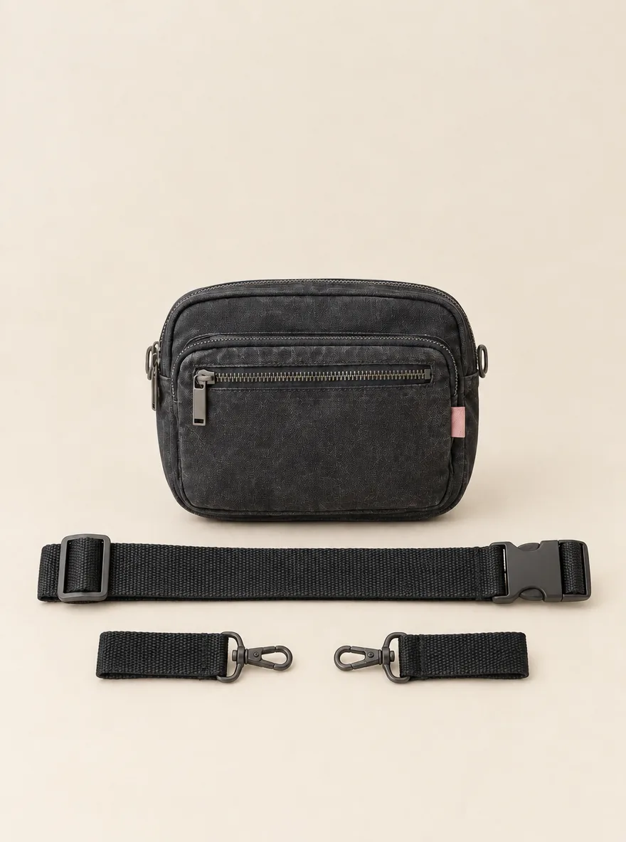 Hip Map Belt Bag with its detachable pieces unclipped and laid beside it