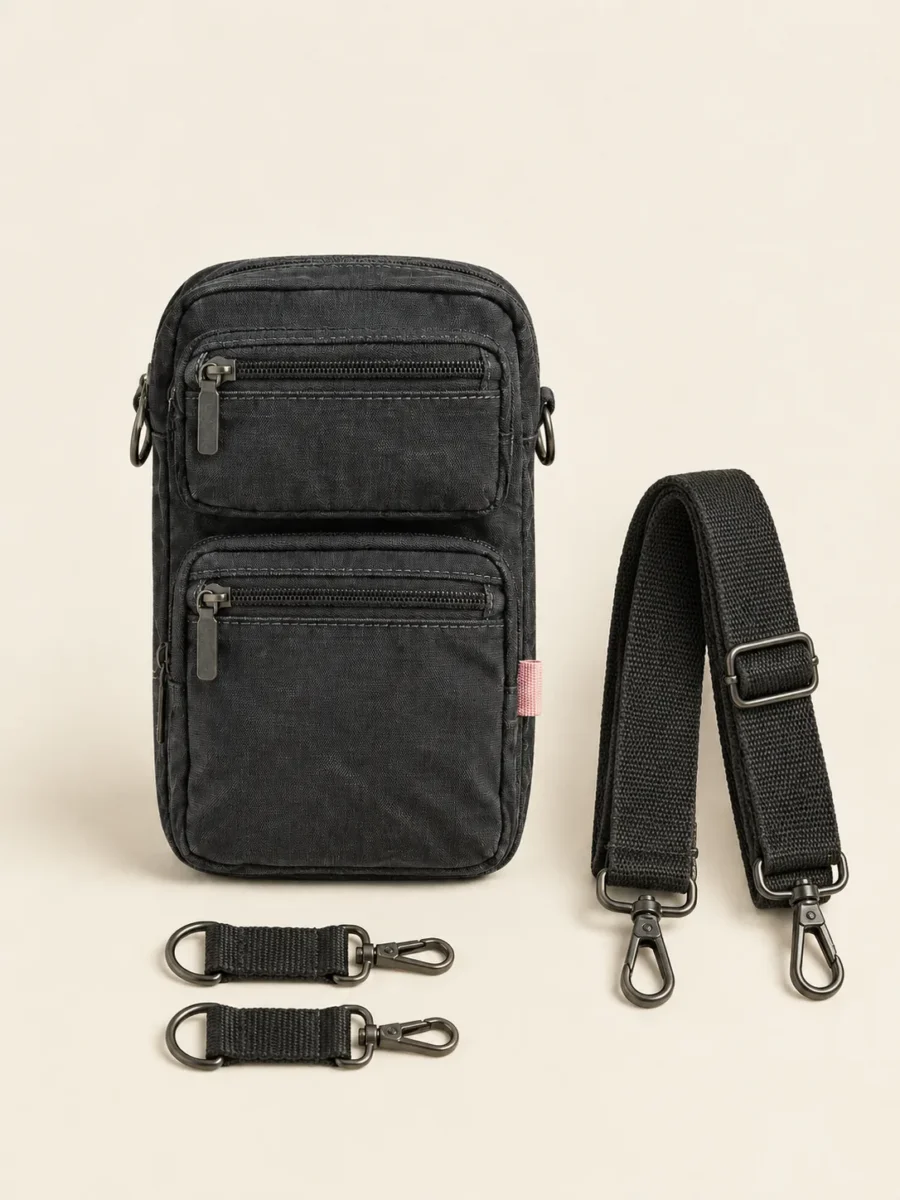 Pocket Stack Crossbody with its detachable pieces unclipped and laid beside it