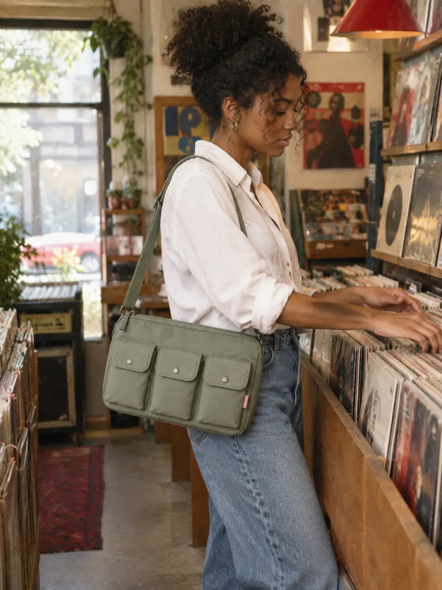 Snap Grid Crossbody in Sage, worn out in the city