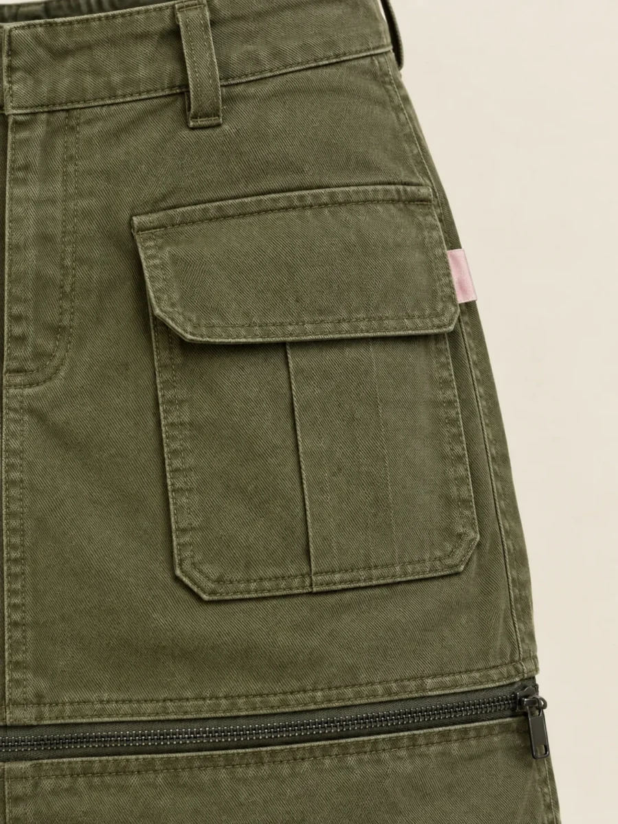 Zip-Off Hem Mini in Olive, close-up of pockets and hardware